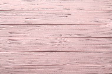 Arkaplan olarak pembe ahşap yüzey dokusu, üst görünüm