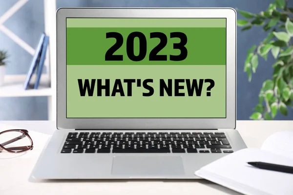 Future trends. 2023 What\'s New? text on laptop display. Modern device on table