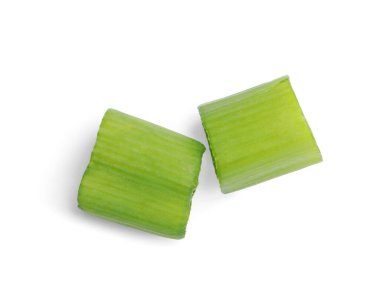 Pieces of fresh green onion on white background, top view