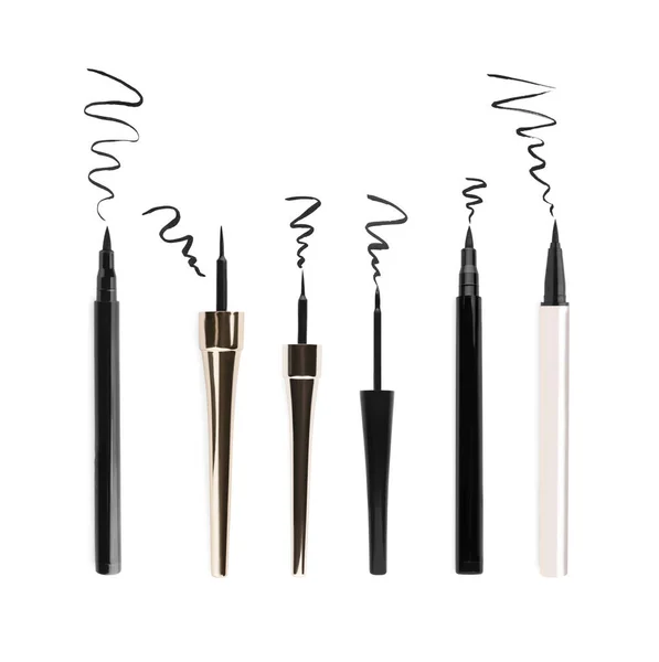 stock image Collage with different eyeliners and strokes on white background, top view