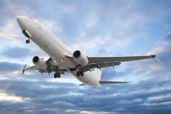 Stock image Plane in sky during sunset, low angle view