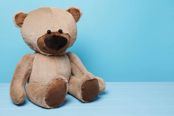 Cute Teddy Bear Wooden Table Light Blue Background Space Text — Stock Photo, Image