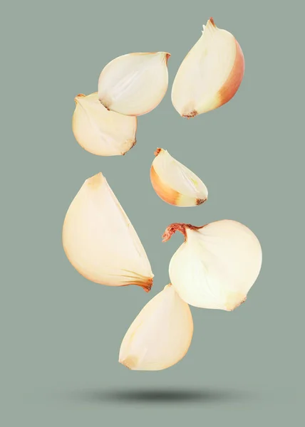 Cut Fresh Onions Falling Light Grey Background — Stock Photo, Image