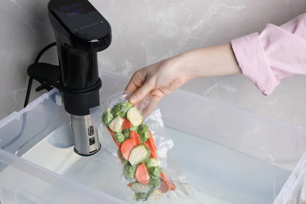 Woman Putting Vacuum Packed Vegetables Box Thermal Immersion Circulator Closeup — Stockfoto