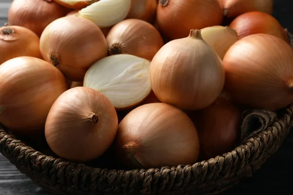 Whole Cut Onions Black Wooden Table Closeup — Stock fotografie