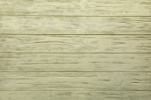 Texture of pale yellow wooden surface as background, top view