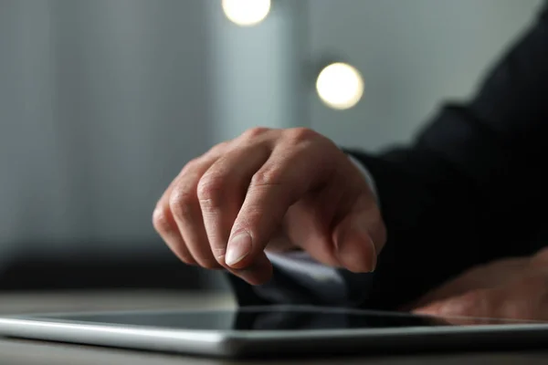 stock image Closeup view of man using new tablet at desk indoors