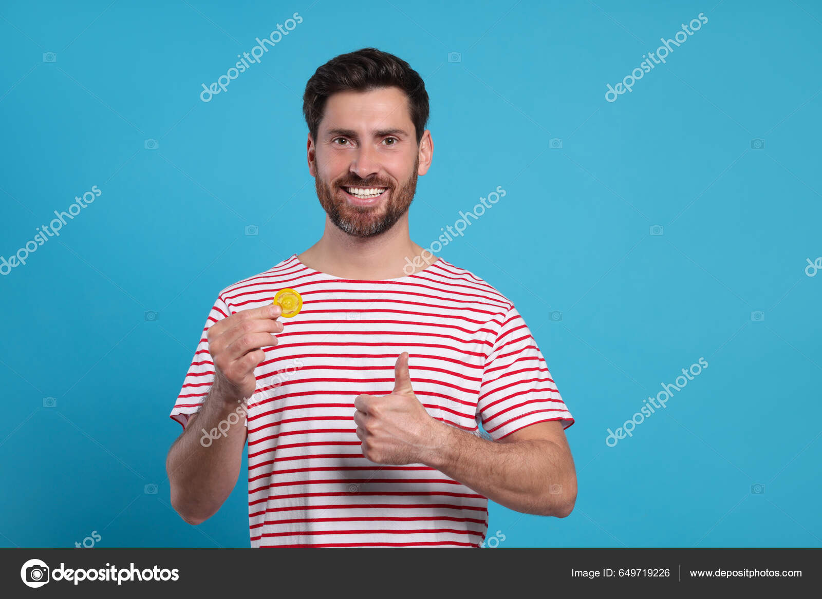 Happy Man Condom Showing Thumb Light Blue Background Safe Sex.