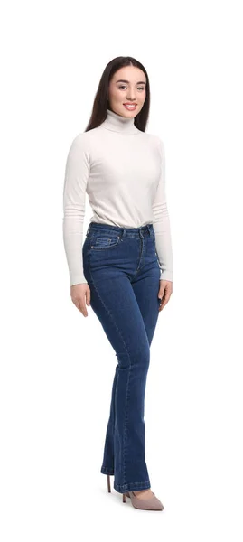 白色背景时尚牛仔裤的年轻女子 — 图库照片