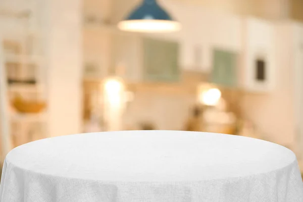 White tablecloth on table in kitchen. Space for text
