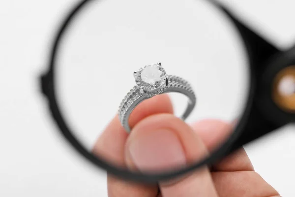Jeweler Examining Diamond Ring Magnifying Glass White Background Closeup — Stock Photo, Image