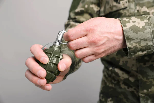 Soldier Pulling Safety Pin Out Hand Grenade Light Grey Background — Stock Photo, Image