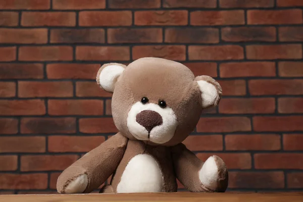 Cute Teddy Bear Wooden Table Brick Wall — Stock Photo, Image
