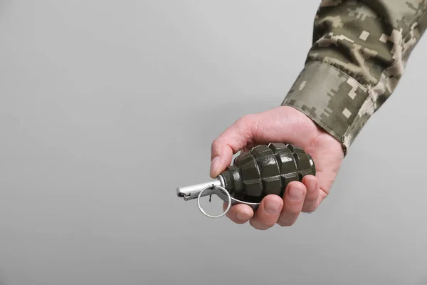 Soldier Holding Hand Grenade Light Grey Background Closeup Space Text — Stock Photo, Image