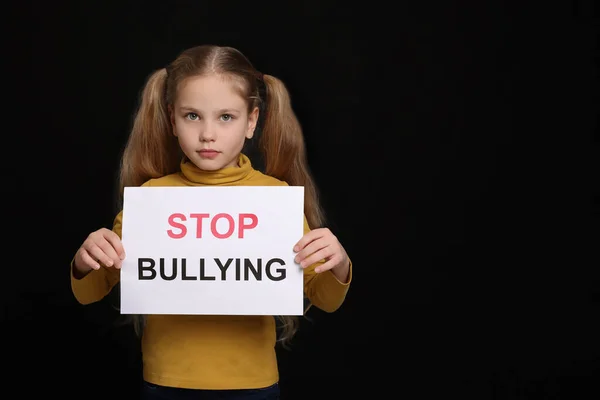 Girl Holding Sign Phrase Stop Bullying Black Background Space Text — Stock Photo, Image
