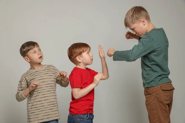 Boy Clenched Fists Bullying Scared Kids Light Grey Background — Stock Photo, Image