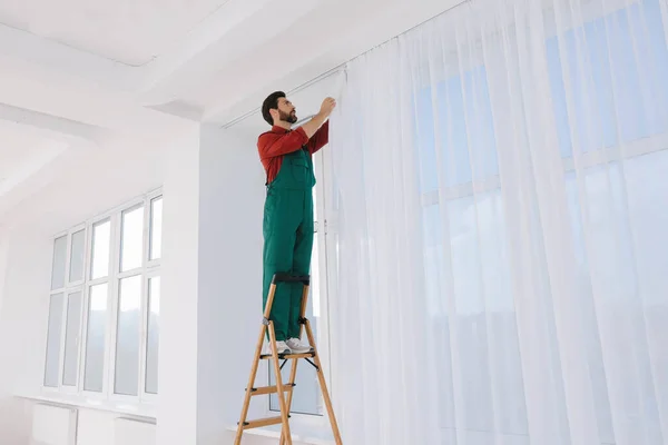 Worker Uniform Hanging Window Curtain Indoors Low Angle View — Stock Photo, Image