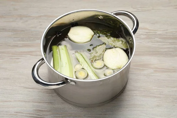 Different Ingredients Cooking Tasty Bouillon Pot White Wooden Table — Stock Photo, Image