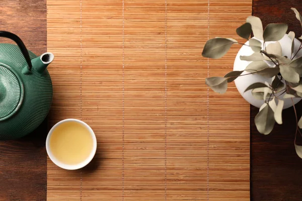 Bamboo Mat Teapot Cup Tea Vase Plant Wooden Table Flat — Stock Photo, Image