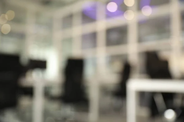 stock image Blurred view of cozy workspaces with tables and chairs in office