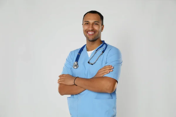 Doctor Medical Assistant Male Nurse Uniform Stethoscope Light Grey Background — Φωτογραφία Αρχείου