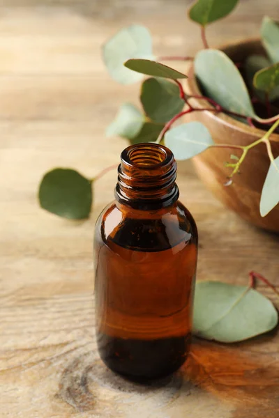 Bottle Eucalyptus Essential Oil Leaves Wooden Table — Stock Photo, Image