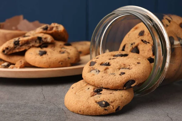 Glass Jar Delicious Chocolate Chip Cookies Grey Table Closeup — Stock Photo, Image