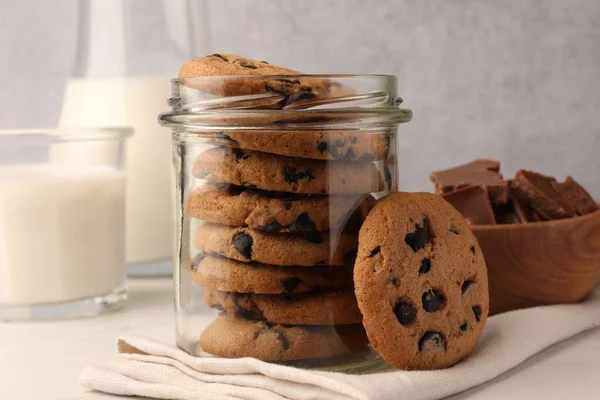 Glass Jar Delicious Chocolate Chip Cookies Milk White Marble Table — Stock Photo, Image