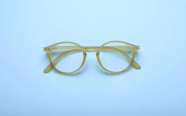 Brille Mit Korrekturgläsern Auf Hellblauem Hintergrund Draufsicht — Stockfoto