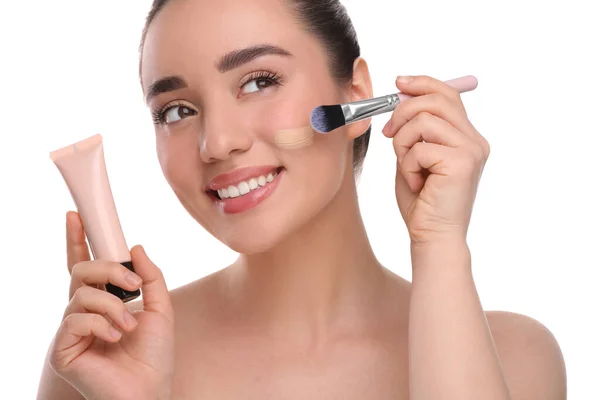 Woman Tube Applying Foundation Face Using Brush White Background — Stock Photo, Image