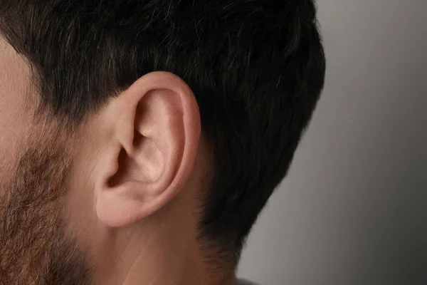 Man Grey Background Closeup Ear — Φωτογραφία Αρχείου