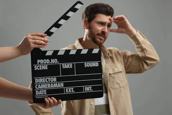 Emotional Actor Performing While Second Assistant Camera Holding Clapperboard Grey — Stockfoto