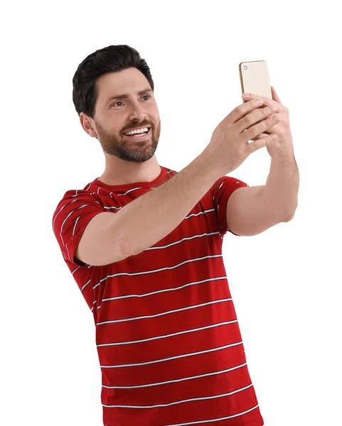 笑的男人拿着智能手机在白色背景下自拍 — 图库照片