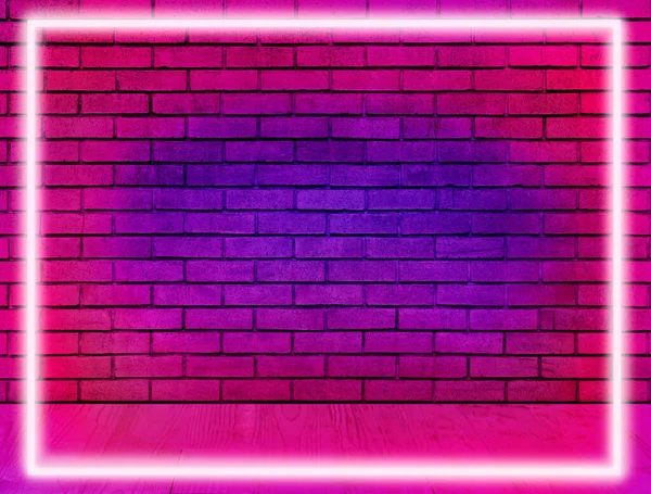 Glowing neon frame in room with brick wall