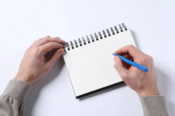 Man Pen Empty Notepad White Background Top View — Stock Fotó