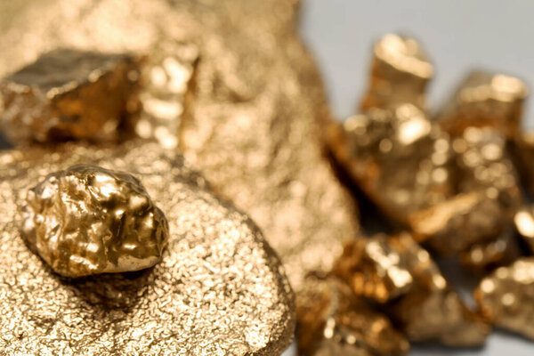 Closeup view of shiny gold nuggets, closeup. Space for text