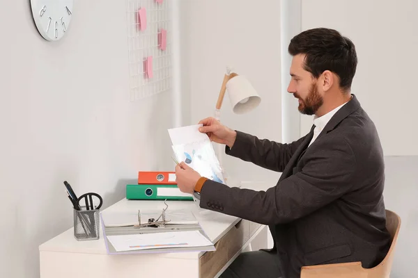 Businessman Putting Document Punched Pocket White Table Office — Stock Photo, Image