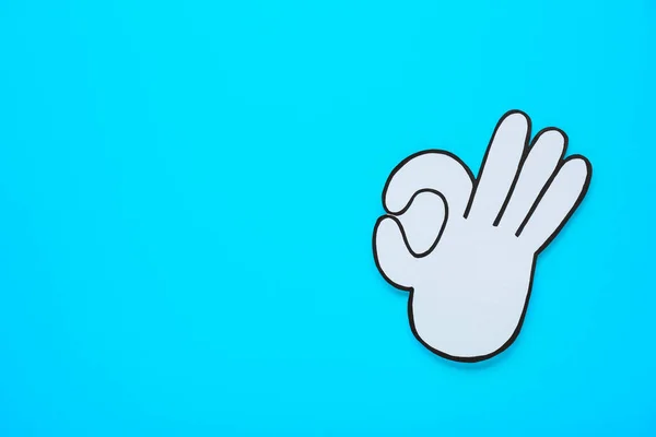 Paper Cutout Okay Hand Gesture Light Blue Background Top View — Stock Photo, Image