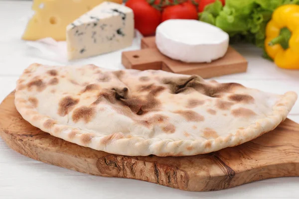 Delicious Cheese Calzone White Wooden Table Closeup — Stock Photo, Image