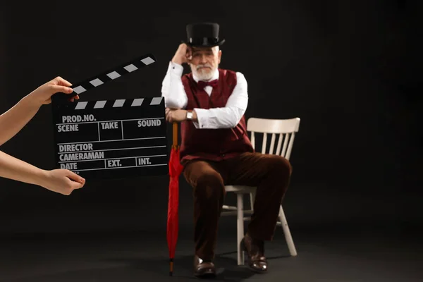 Senior Actor Performing Role While Second Assistant Camera Holding Clapperboard — Zdjęcie stockowe