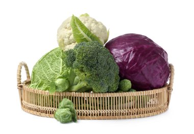 Wicker tray with different types of fresh cabbage on white background