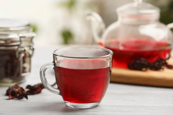 stock image Delicious hibiscus tea on white wooden table