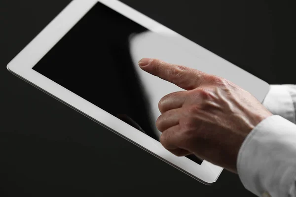 stock image Closeup view of man using new tablet indoors