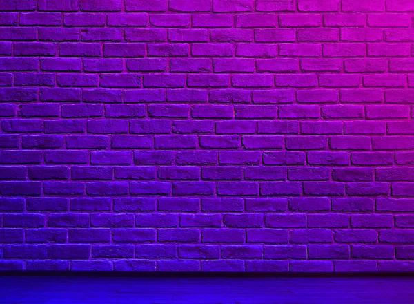 Stock image Room with brick wall and wooden floor in neon lights