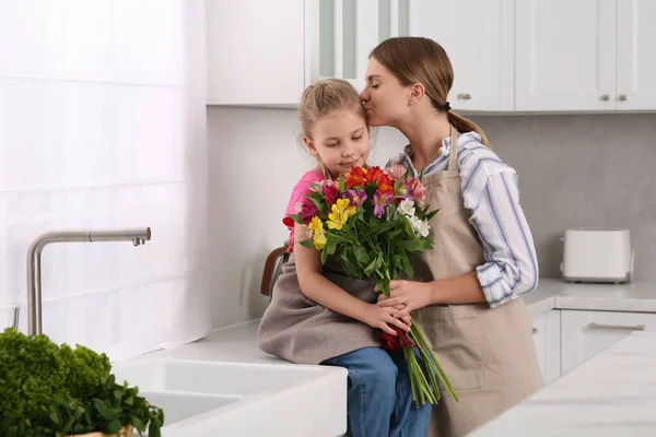 Little Daughter Congratulating Mom Bouquet Flowers Kitchen Happy Mother Day — Stock Photo, Image