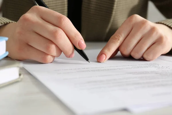 Woman Signing Document Wooden Table Closeup Royalty Free Stock Images