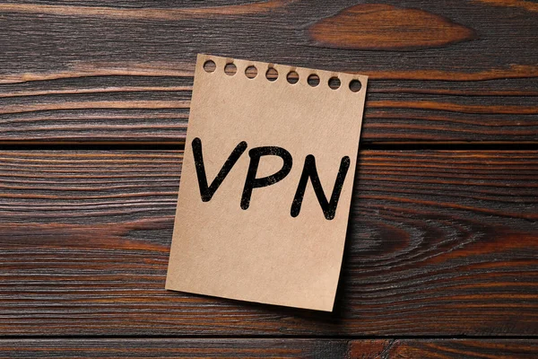 stock image Paper sheet with acronym VPN (Virtual Private Network) on wooden table top view