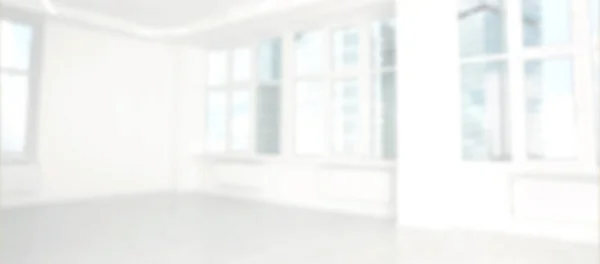 Modern office room with white walls and windows, blurred view. Banner design