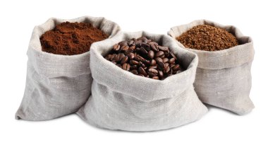 Bags with different types of coffee on white background clipart