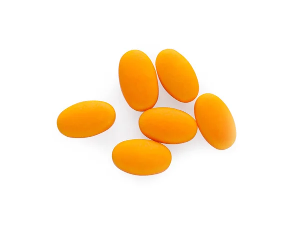 白い背景においしいオレンジ色のドライキャンディー トップビュー — ストック写真